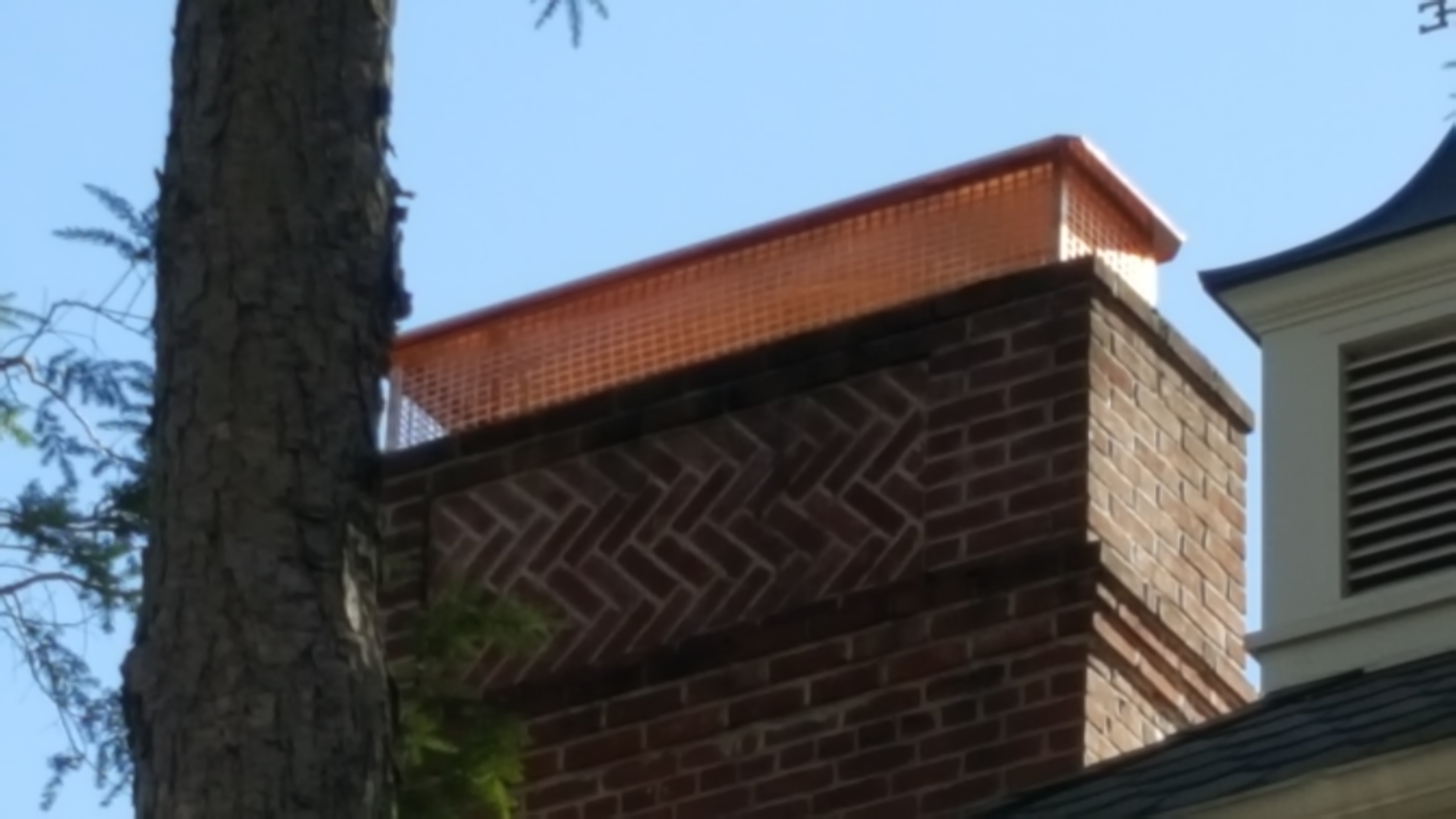 New stainless steel chimney cap installed in Oceanside, NY