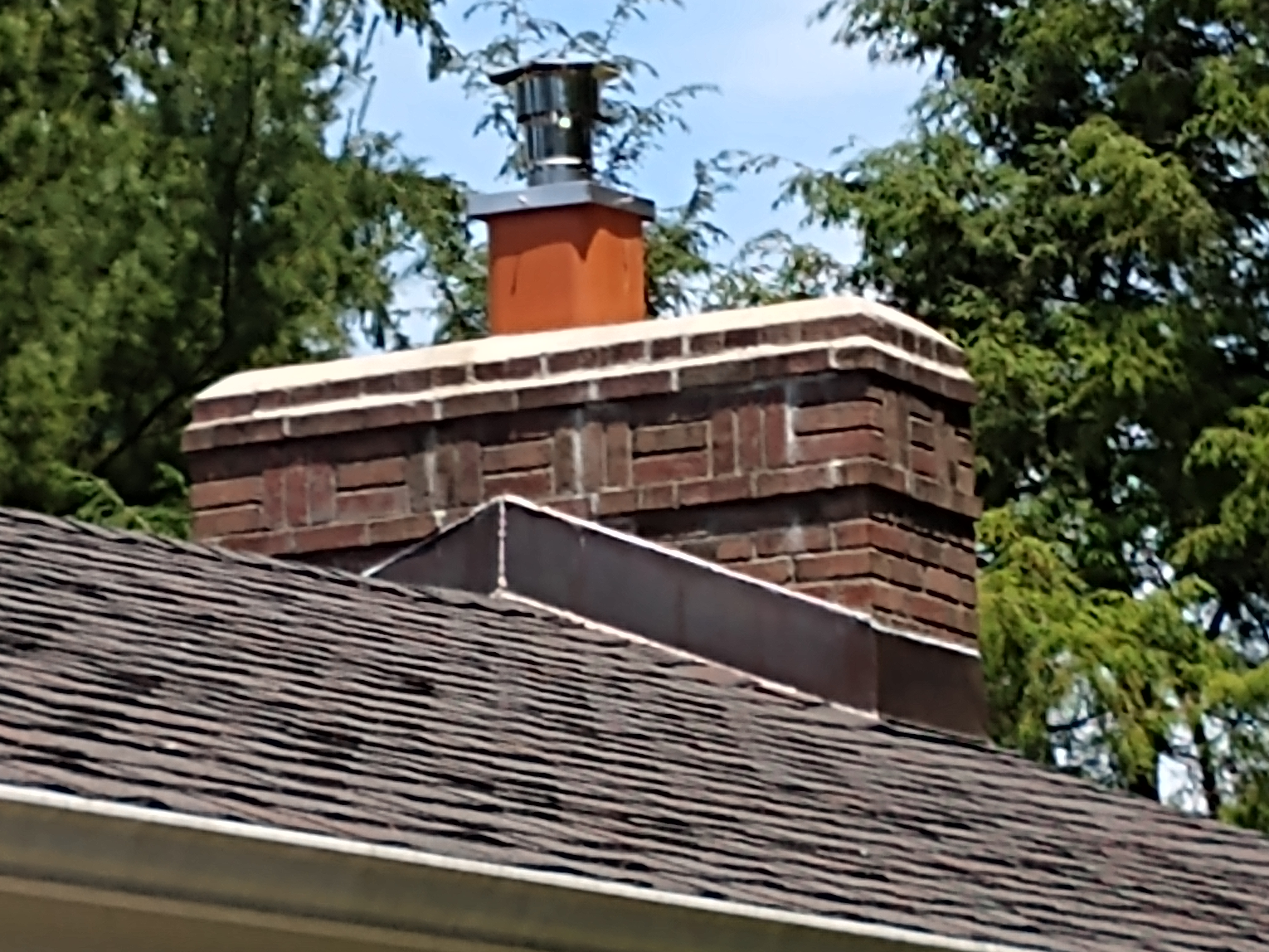 Stainless steel chimney cap with animal guard in Oceanside, New York